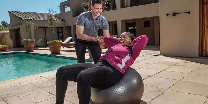 At-home personal trainer demonstrating functional movement patterns