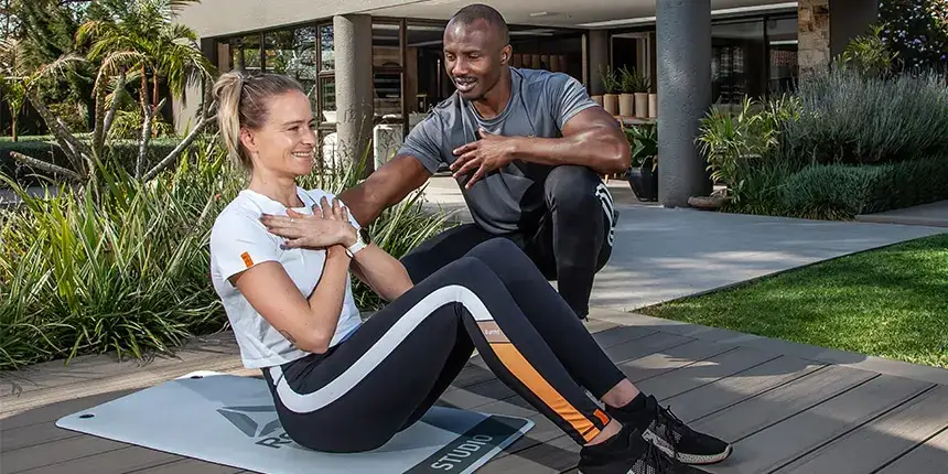 At-home personal trainer supporting a client through a weight management programme